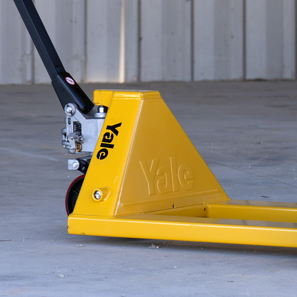 A forklift operator looks through overhead guard