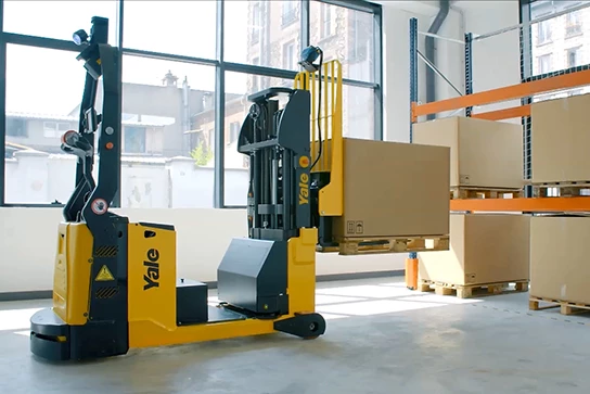 A Yale robotic CB stacker lifting a box onto a warehouse rack