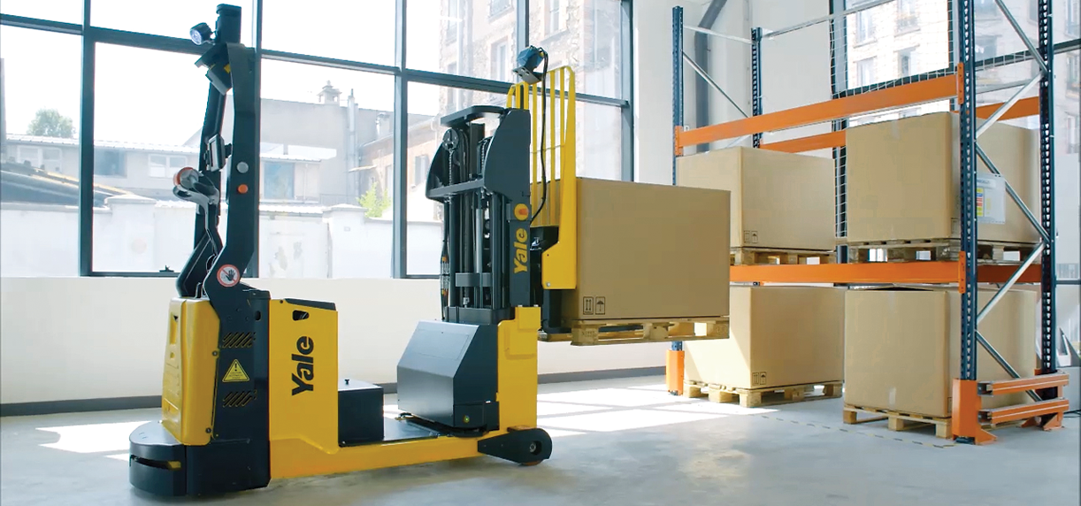 A Yale robotic counterbalanced stacker lifting a box onto a warehouse rack