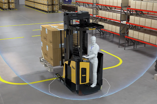 Forklift operator drives a reach truck with a full pallet-load